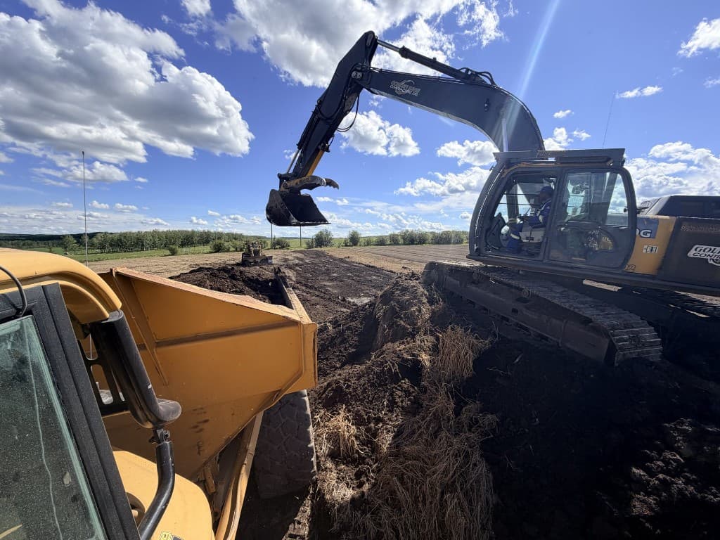 Wolfpack excavator and haul truck on site